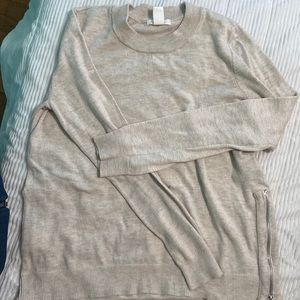 H&M Conscious crewneck sweater with side zipper detail.